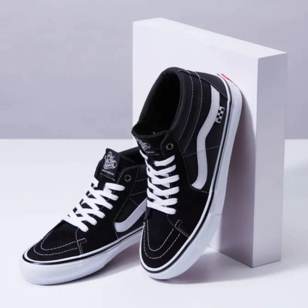 Vans black leather mid height sneakers. Mens size 8 womens size 9.5